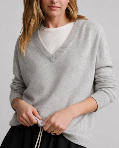 V-neck knit jumper showing clear neckline structure for wholesale production